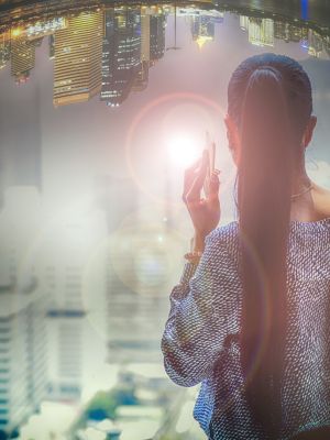 A woman stares out a window at a distorted vision of a city - looking into the future