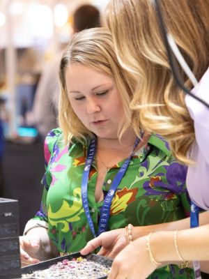 Two women lokking at jewelry during the Atlanta Jewelry Show